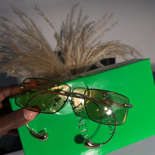 Drop Rectangular Sunglasses Bottega Veneta gold-tone rimless sunglasses with yellow-tinted lenses.