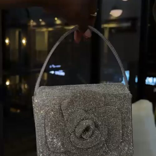 Oscar de la Renta Crystal Pavé Mini TRO bag in a silver/dark grey color with a floral appliqué.