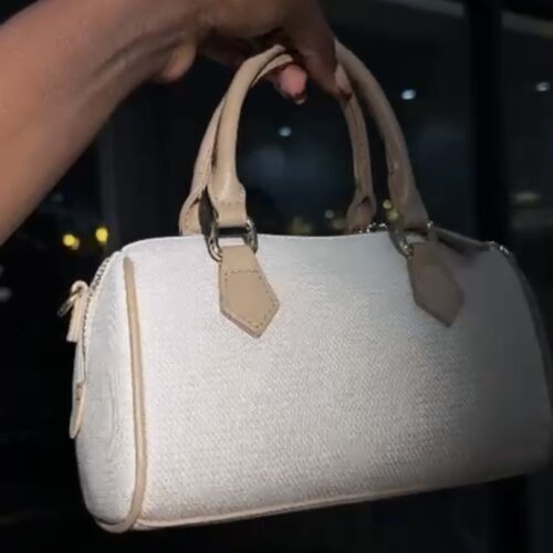 This is a Gucci mini logo-print tote bag in beige cotton canvas with leather trim