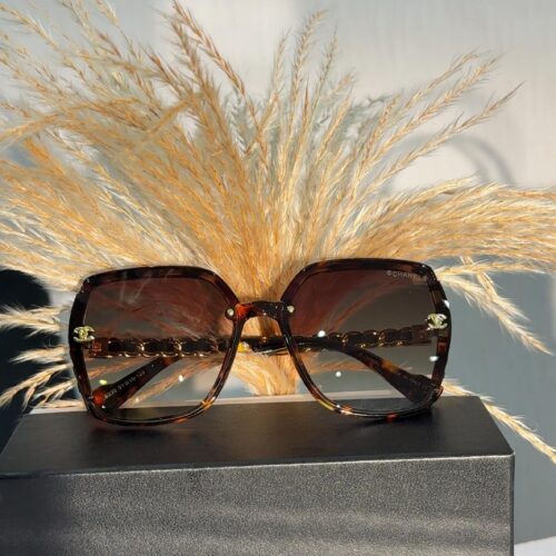 Chanel CH5210Q square sunglasses in a brown tortoise acetate frame with gold-tone chain temples.
