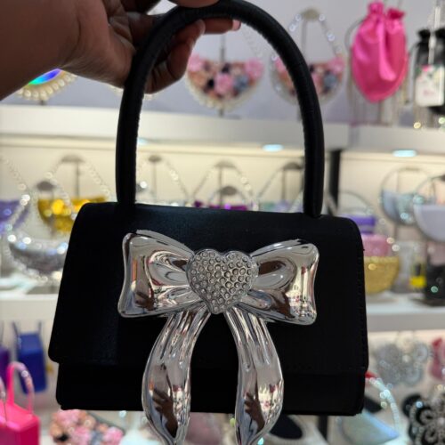 Faina Handbag with a crystal-embellished bow plaque.