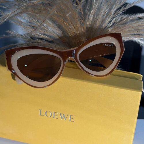 Loewe Swan Slim cat-eye sunglasses in brown with a white inner frame.