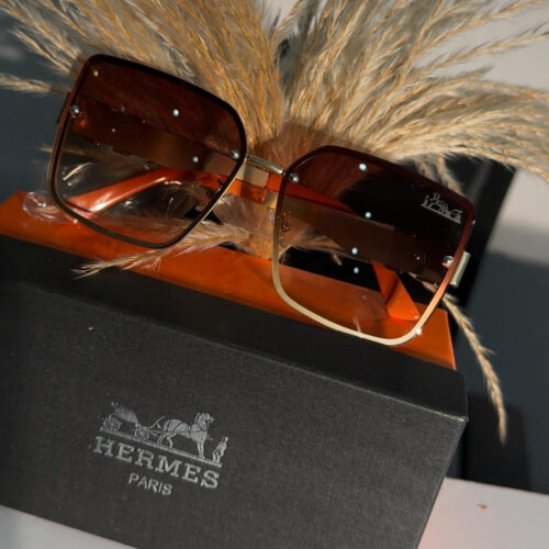 Hermes Paris 9196 model square sunglasses with a gold-tone frame and brown gradient lenses