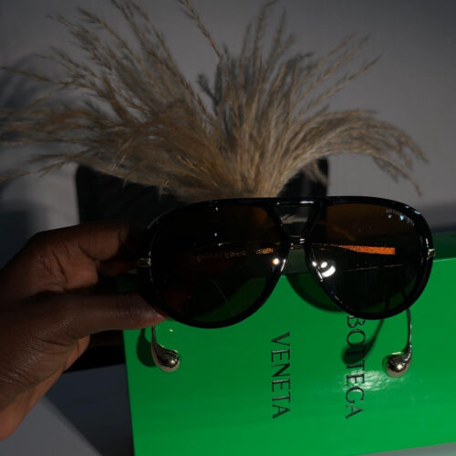 Bottega Veneta Drop aviator sunglasses in black acetate with gold-tone hardware.